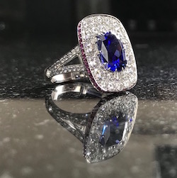 A diamond, sapphire and ruby ring set in platinum from Clare Blatherwick Jewellery FGA DGA