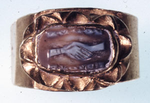 Figure 4. Nicolo cameo engraved with the ceremony of joining hands, inscribed in Greek with the word “concord". Material - sardonyx. British Museum